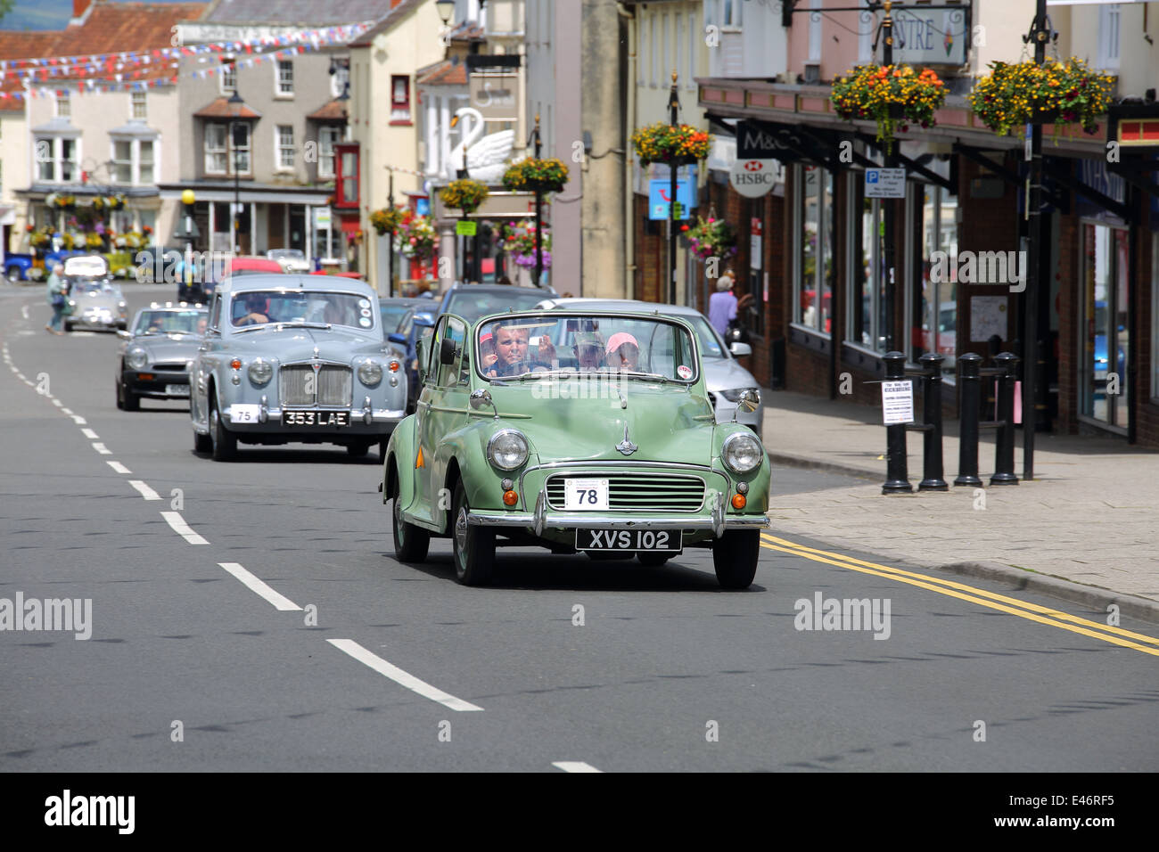 Classic Cars and Bikes driving through Thornbury Town taking part in