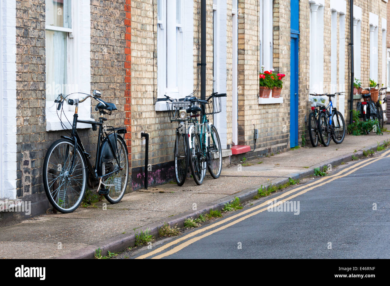 Row of cottages and bicyles parked beside windows in Bury St Edmunds Stock Photo