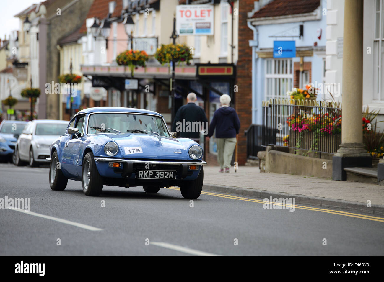 Classic Cars and Bikes driving through Thornbury Town taking part in