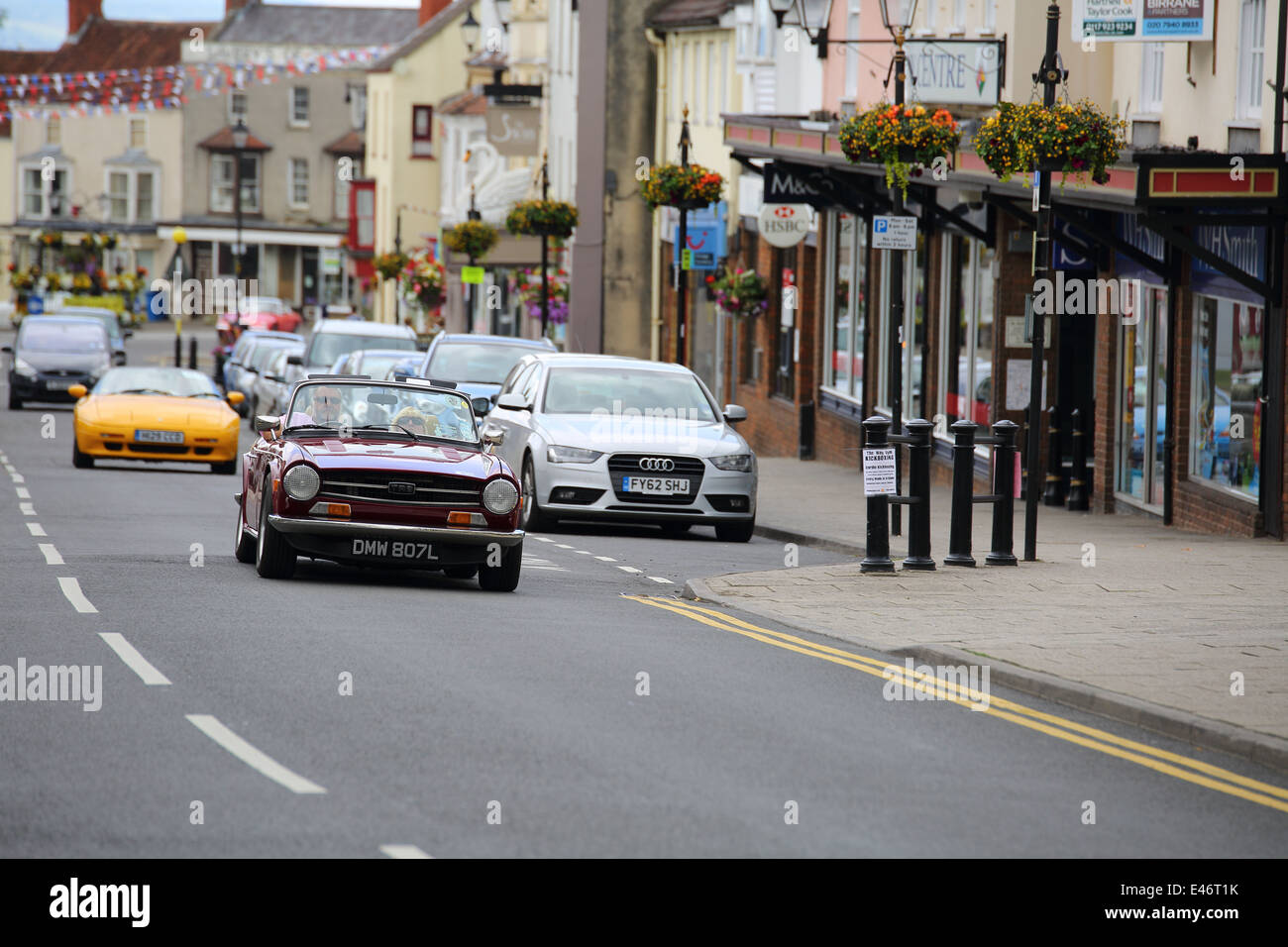 Classic Cars and Bikes driving through Thornbury Town taking part in