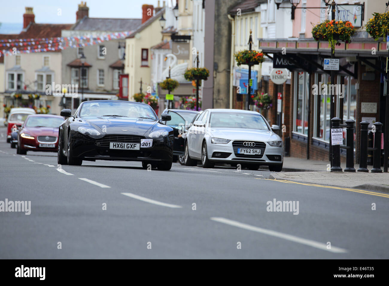Classic Cars and Bikes driving through Thornbury Town taking part in