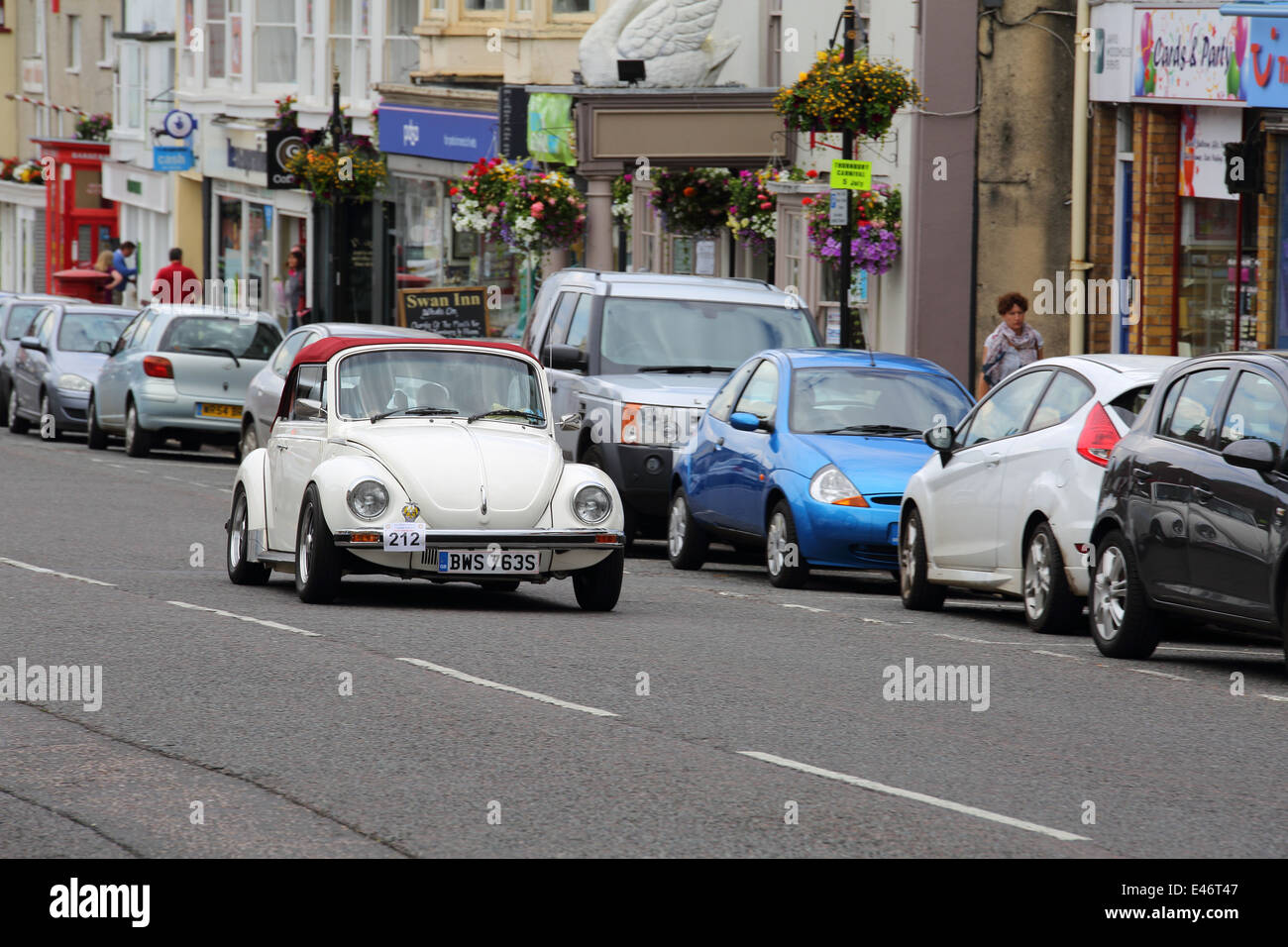 Classic Cars and Bikes driving through Thornbury Town taking part in Chipping Sodbury's Classic Run. Stock Photo