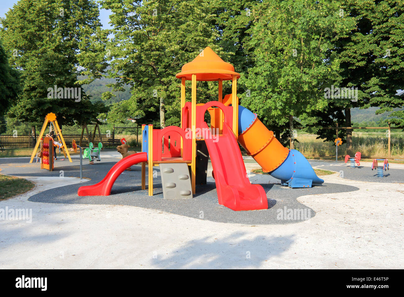 Children's school playground with slides and swings Stock Photo