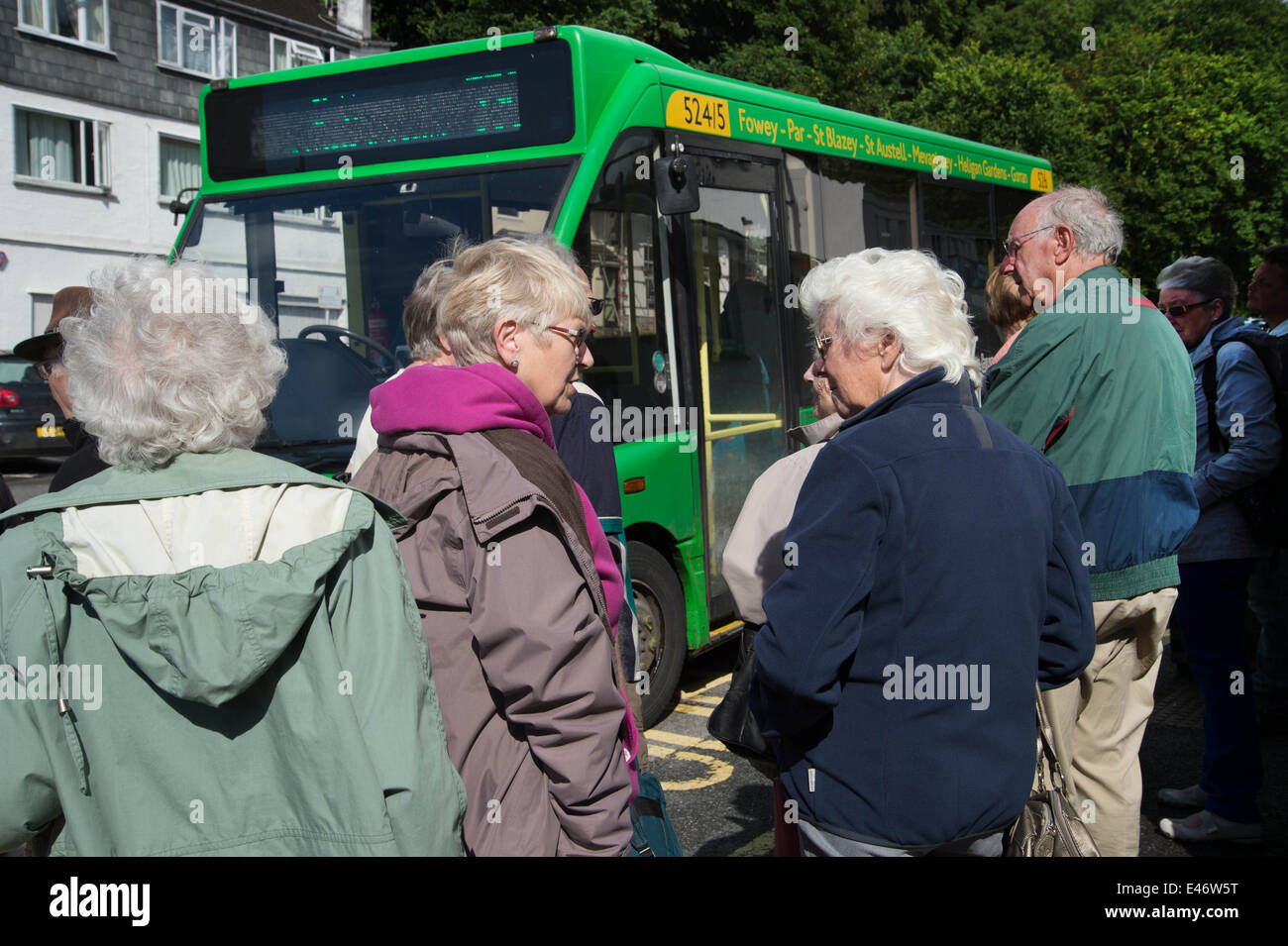 Cornwall. St Mawes. Pensioners and the bus to Truro, waiting to board. Stock Photo