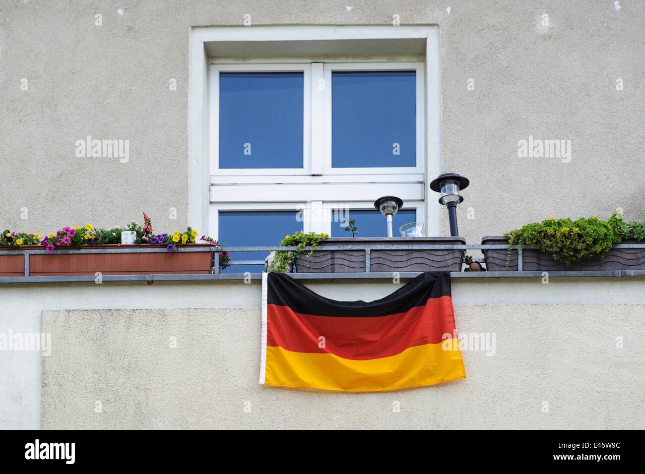 Berlin, Germany. 2nd July, 2014. A Germany-flag hangs on a facade of a building, on July 2, 2014 in Berlin, Germany. Photo: picture alliance/Robert Schlesinger/dpa/Alamy Live News Stock Photo