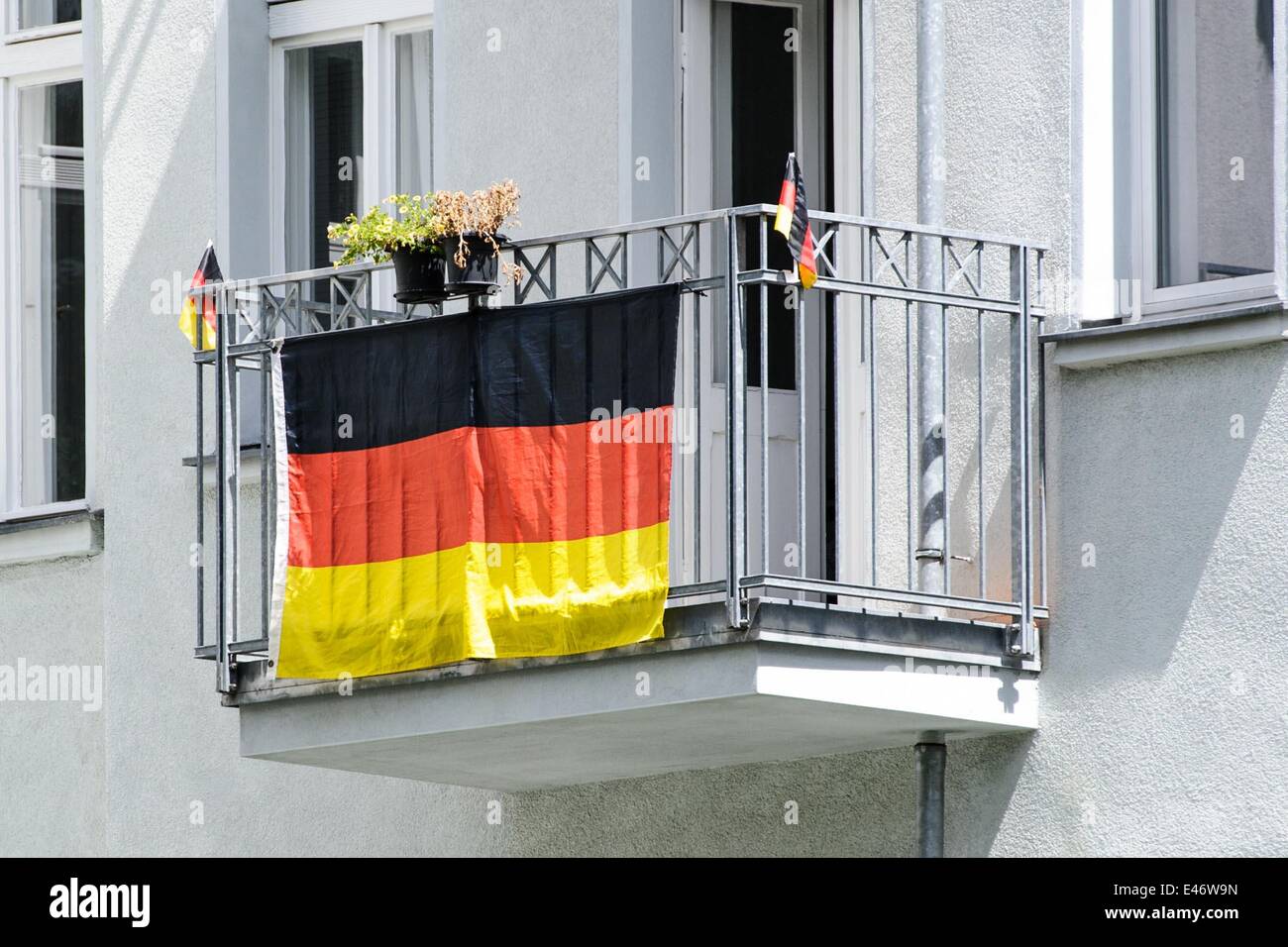 Berlin, Germany. 2nd July, 2014. A Germany-flag hangs on a facade of a building, on July 2, 2014 in Berlin, Germany. Photo: picture alliance/Robert Schlesinger/dpa/Alamy Live News Stock Photo