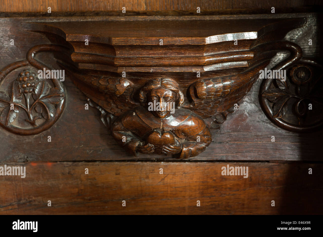 UK, Derbyshire, Peak District, Bakewell, All Saints Church Quire, misericord showing angel holding heart Stock Photo