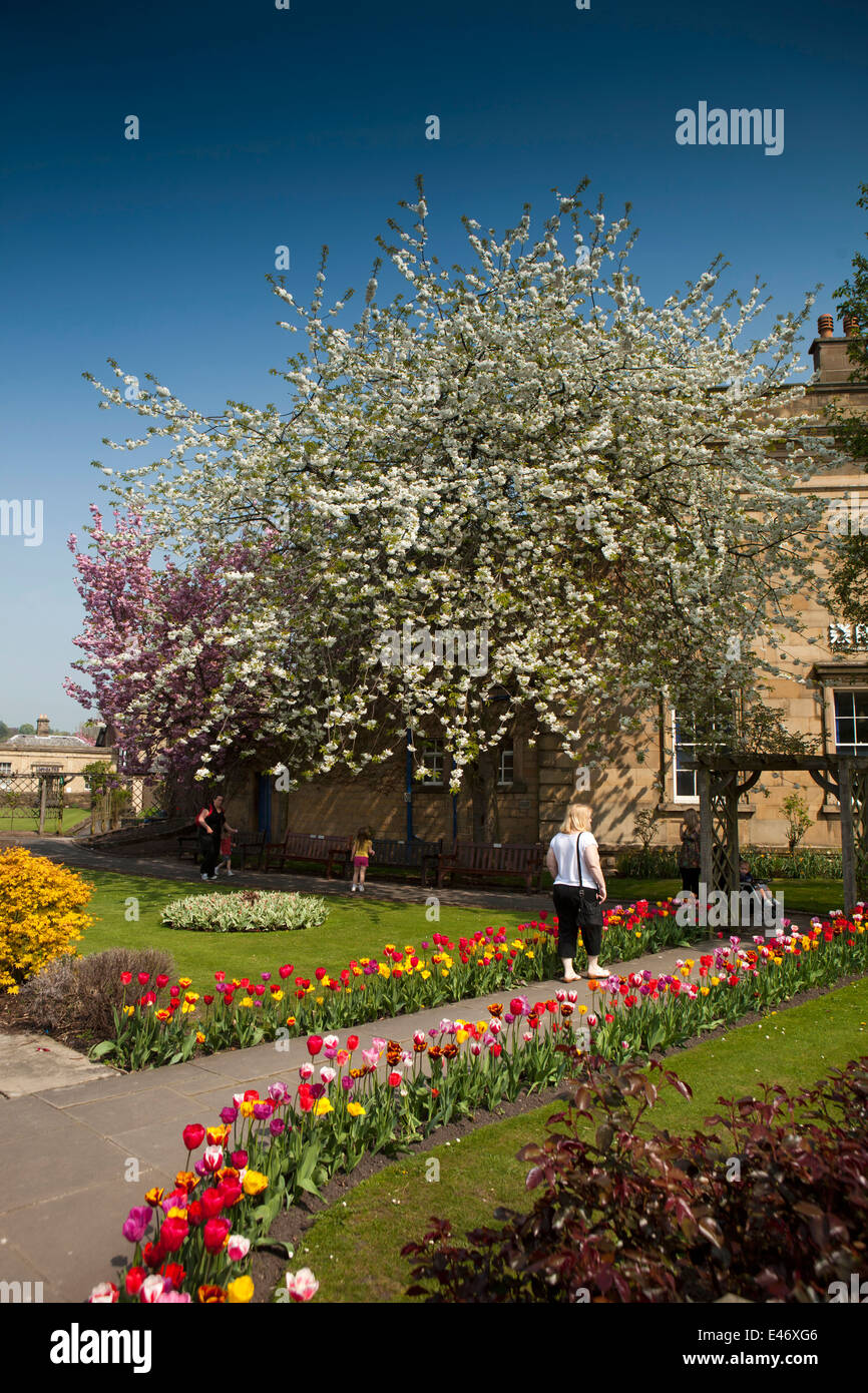 UK, Derbyshire, Peak District, Bakewell, Bath Gardens public park, visitors enjoying colourful flowers Stock Photo