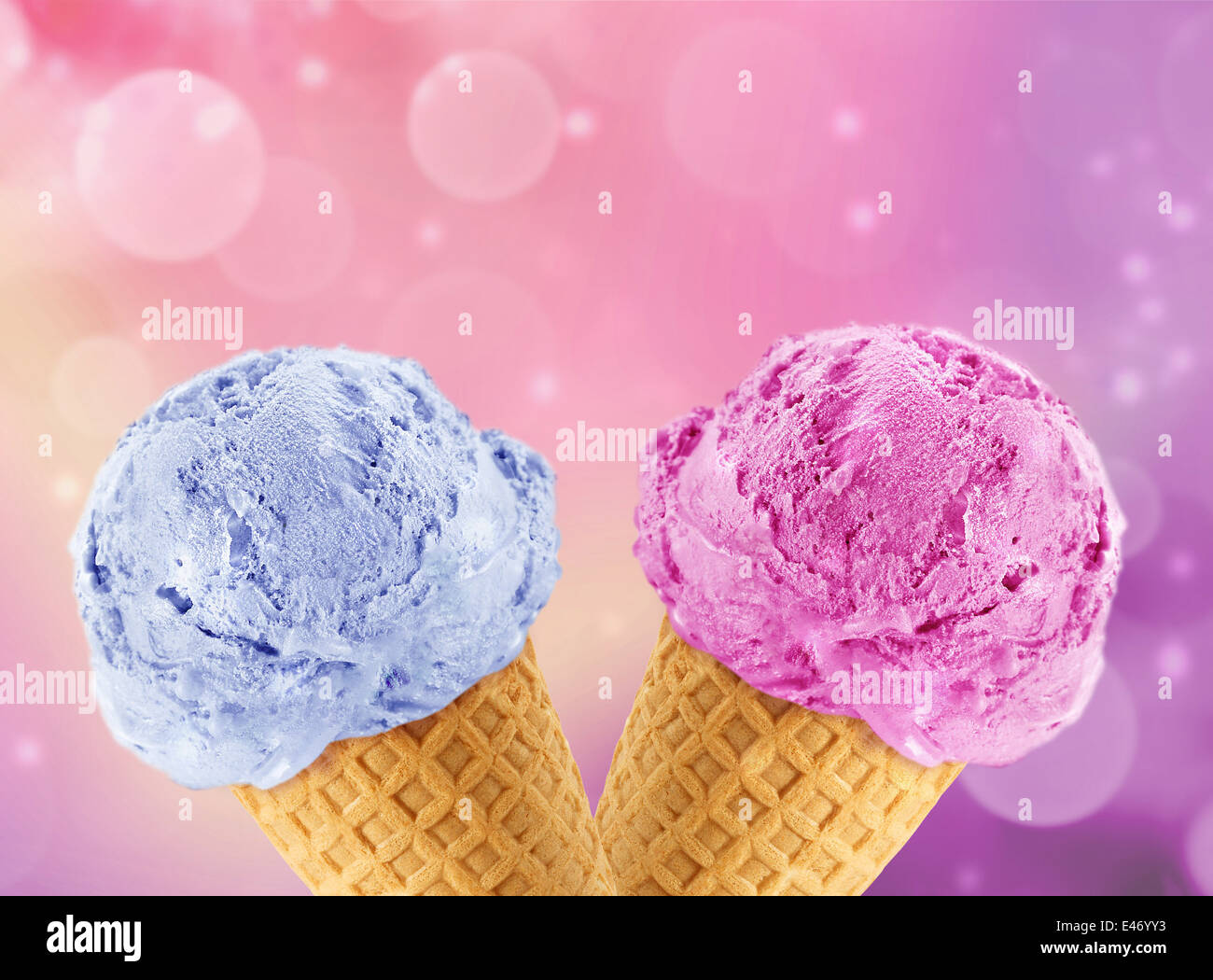 Blue and Pinkberry Ice cream in the cone with abstract light background. Stock Photo