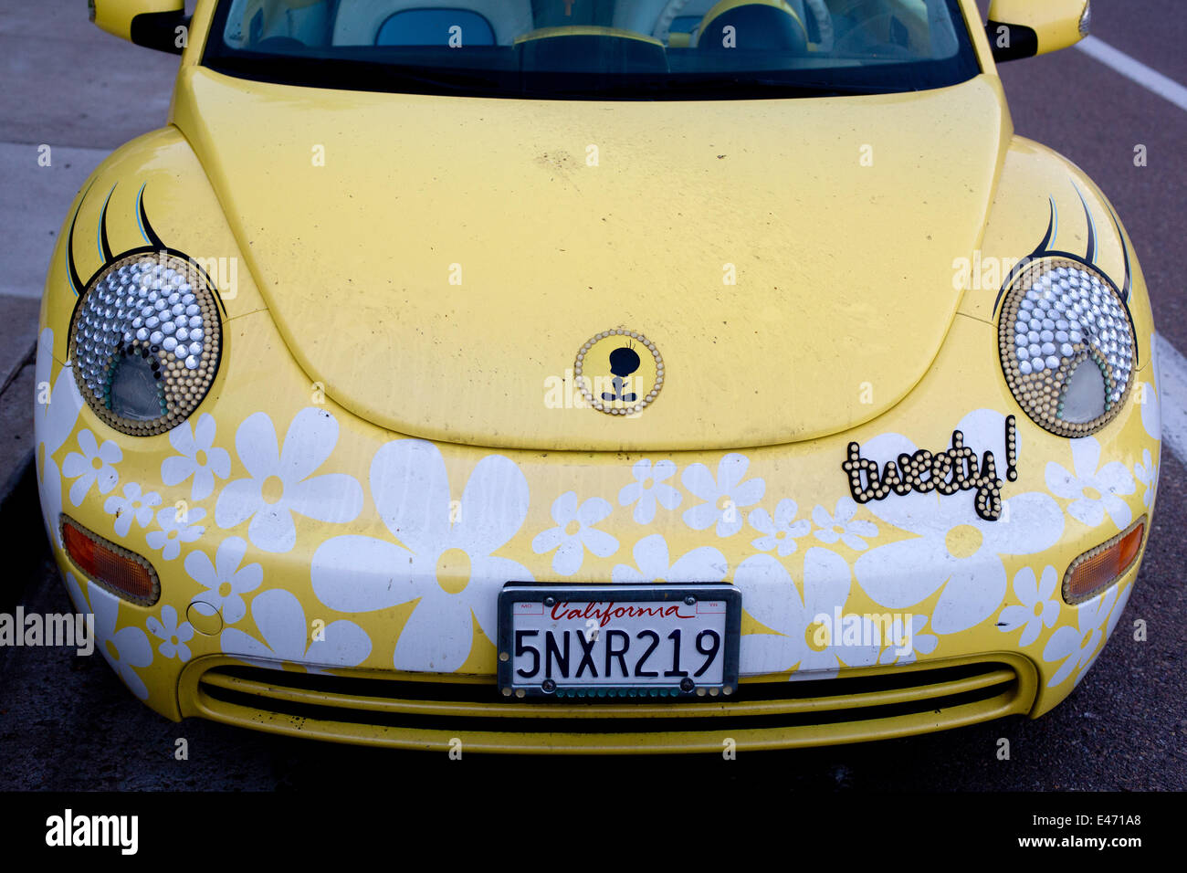Tweety-Version of a VW Beetle, with flower decoration and headlight-eyes with eyelashes, in June 2014. Stock Photo