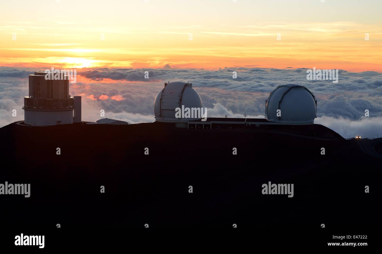 A car drive alongside observatories on the summit of the Mauna Kea