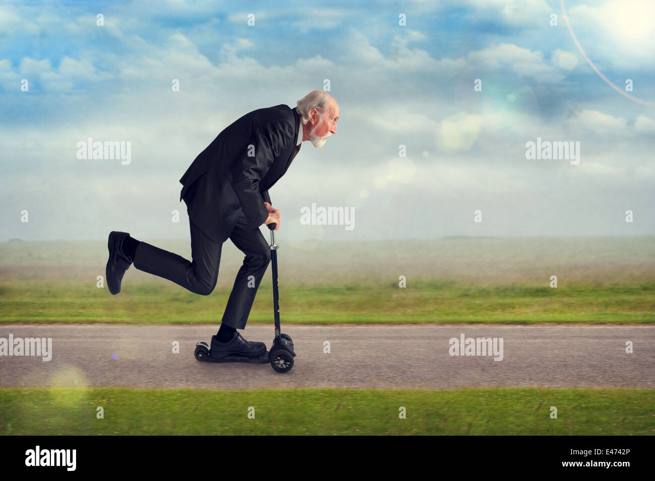 senior man riding a scooter active and energetic Stock Photo