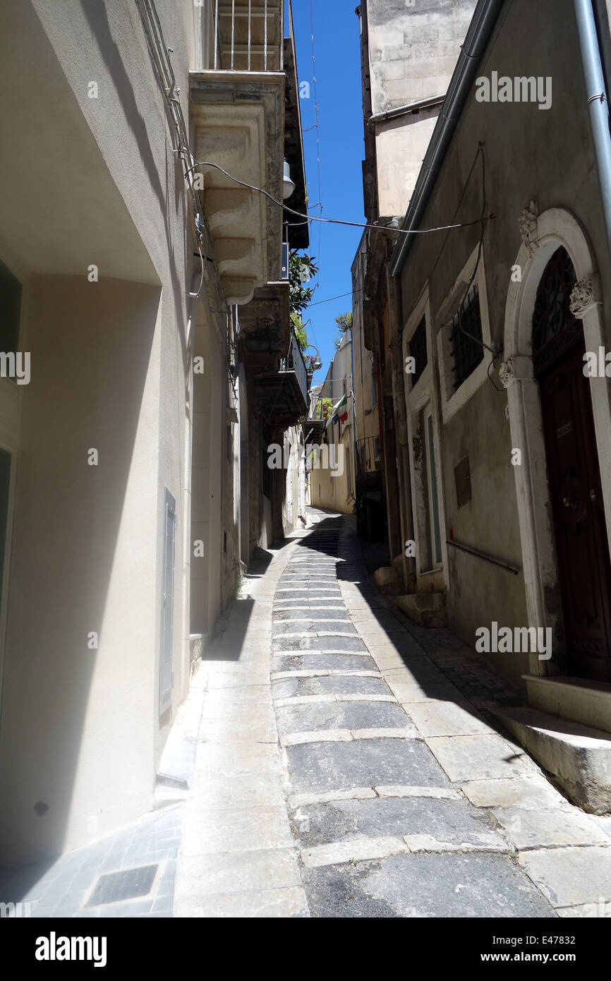 Ragusa's narrow street cause challenging parking problems Stock Photo