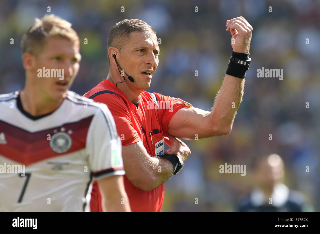 Rio de Janeiro, Brazil. 04th July, 2014. Refree Nestor Pitana (R) of Argentina reacts next to Bastian Schweinsteiger of Germany during the FIFA World Cup 2014 quarter final soccer match between France and Germany at Estadio do Maracana in Rio de Janeiro, Brazil, 04 July 2014. Photo: Andreas Gebert/dpa/Alamy Live News Stock Photo