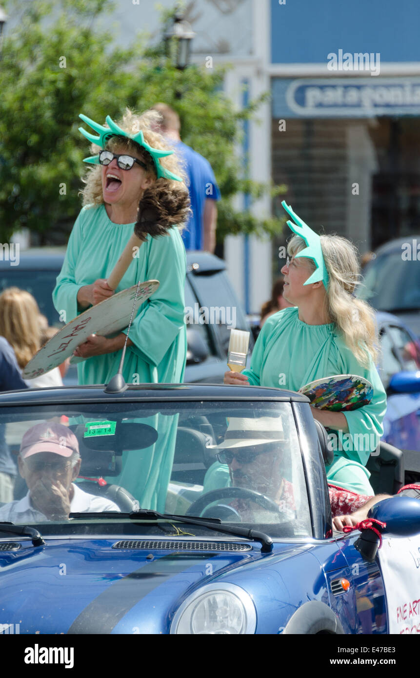 Bar Harbor, Maine, USA. 04th July, 2014. Independencce Day Parade Bar Harbor Maine. Pictured: Two artists dressed as the Statue of Liberty on the ArtWaves Studio float in the Independence Day Parade Credit:  Jennifer Booher/Alamy Live News Stock Photo