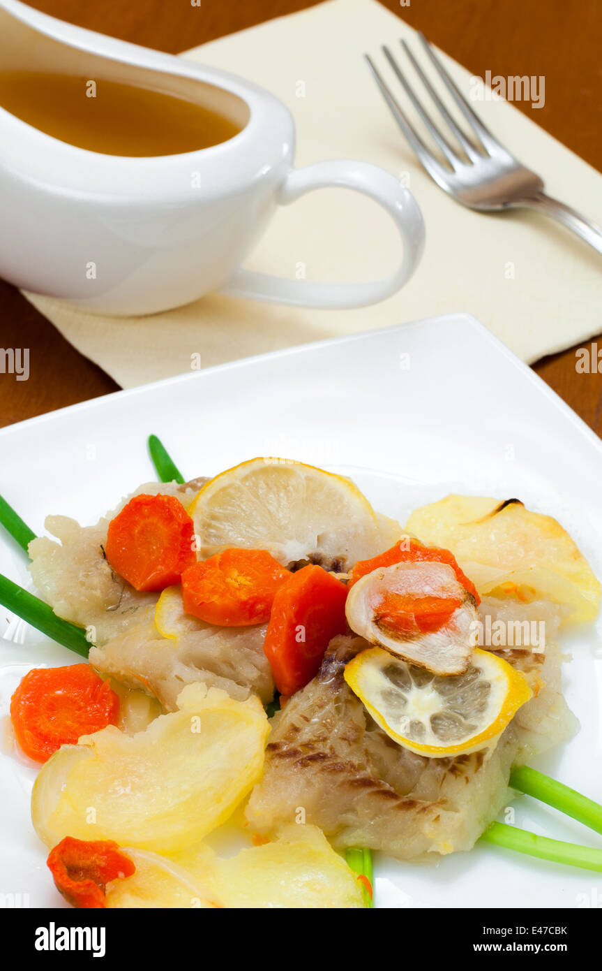 Fish cod vegetables potatoes carrots onions green fillet portion control stewed dish sea seafood meals food ready meal one lunch Stock Photo