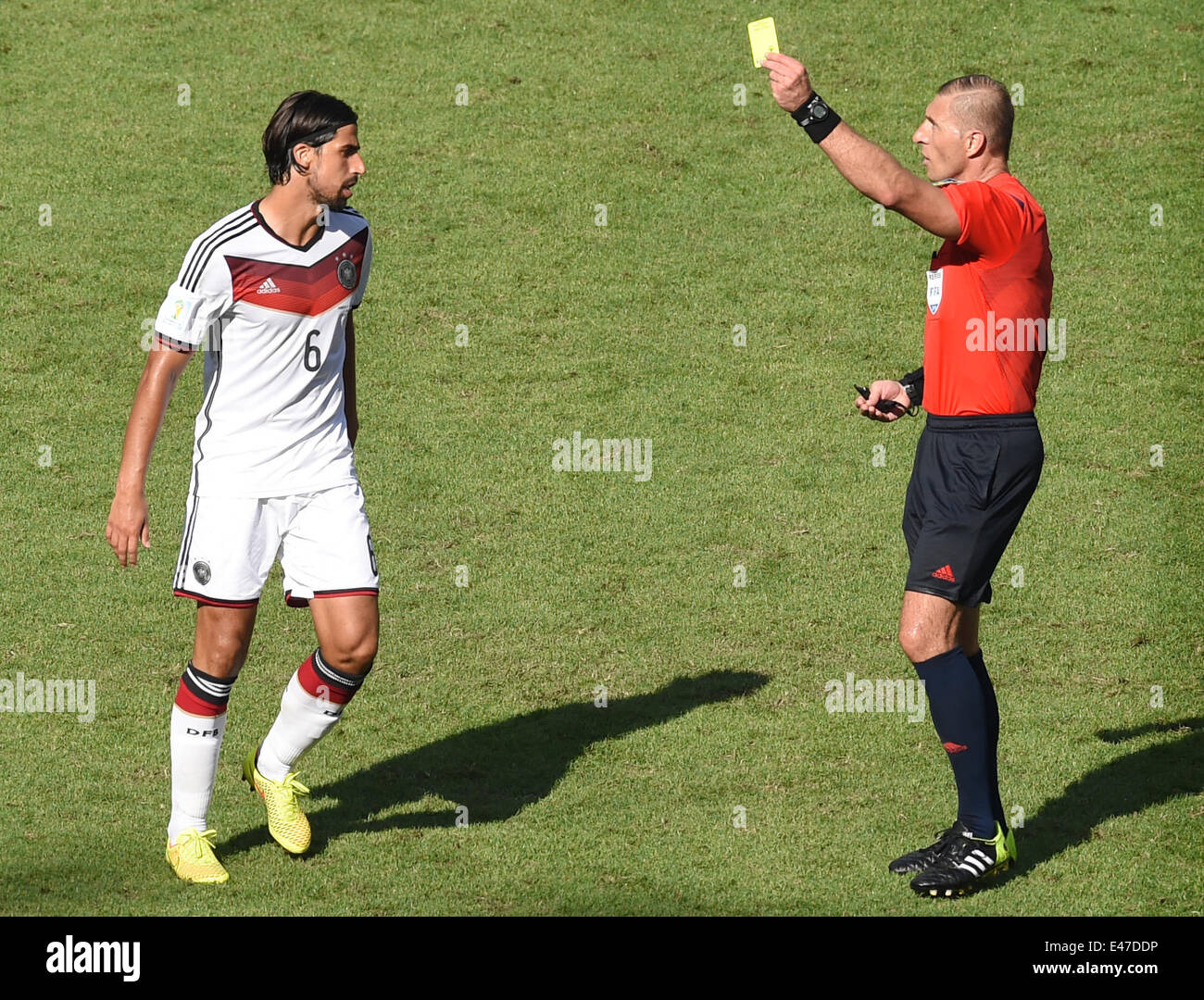Rio de Janeiro, Brazil. 04th July, 2014. Sami Khedira (L) of Germany is shown a yellow card by referee Nestor Pitana during the FIFA World Cup 2014 quarter final soccer match between France and Germany at Estadio do Maracana in Rio de Janeiro, Brazil, 04 July 2014. Photo: Marcus Brandt/dpa/Alamy Live News Stock Photo