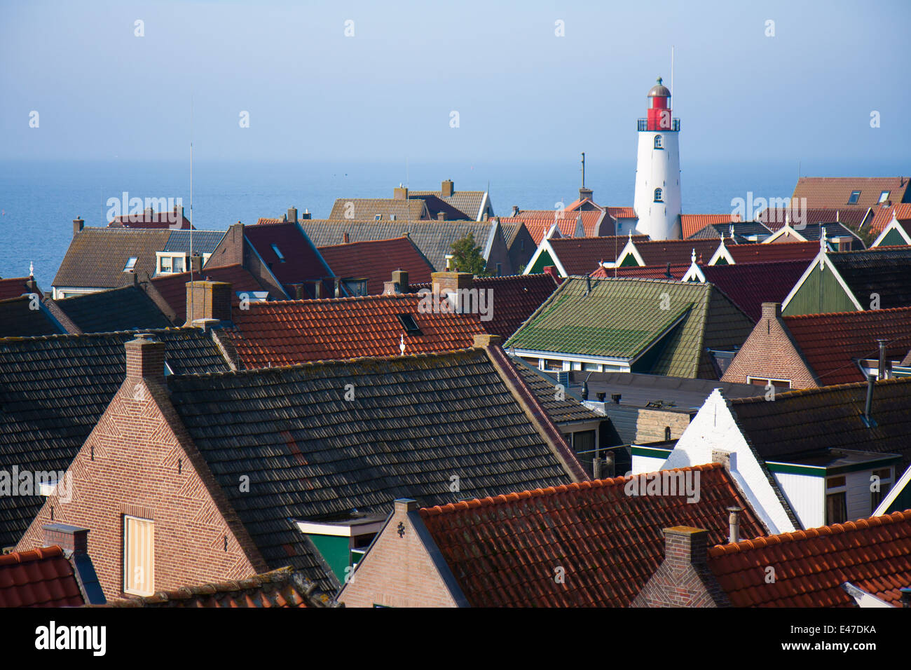 View at the lighthouse and roofs of a pittoresk old fishing village in the netherlands Stock Photo