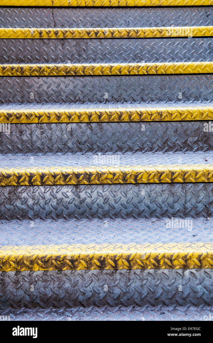 Aluminium steps with yellow safety markings Stock Photo