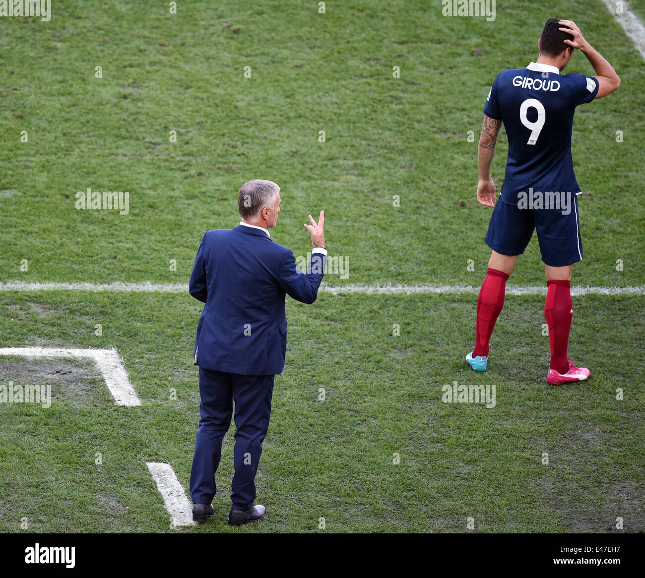 Rio de Janeiro, Brazil. 04th July, 2014. Head coch Didier Deschamps of France gestures next to Olivier Giroud (R) of France during the FIFA World Cup 2014 quarter final soccer match between France and Germany at Estadio do Maracana in Rio de Janeiro, Brazil, 04 July 2014. Photo: Marcus Brandt/dpa/Alamy Live News Stock Photo