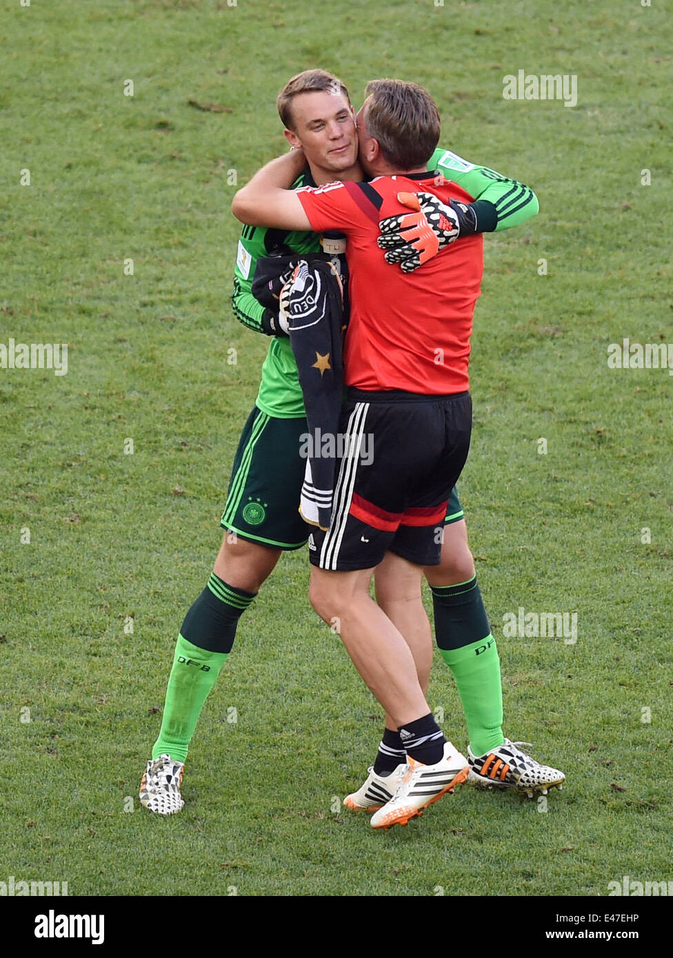 Rio de Janeiro, Brazil. 04th July, 2014. Goalkeeper coach Andreas Koepke (R) of Germany hugs goalkeeper Manuel Neuer after the FIFA World Cup 2014 quarter final soccer match between France and Germany at Estadio do Maracana in Rio de Janeiro, Brazil, 04 July 2014. Photo: Marcus Brandt/dpa/Alamy Live News Stock Photo