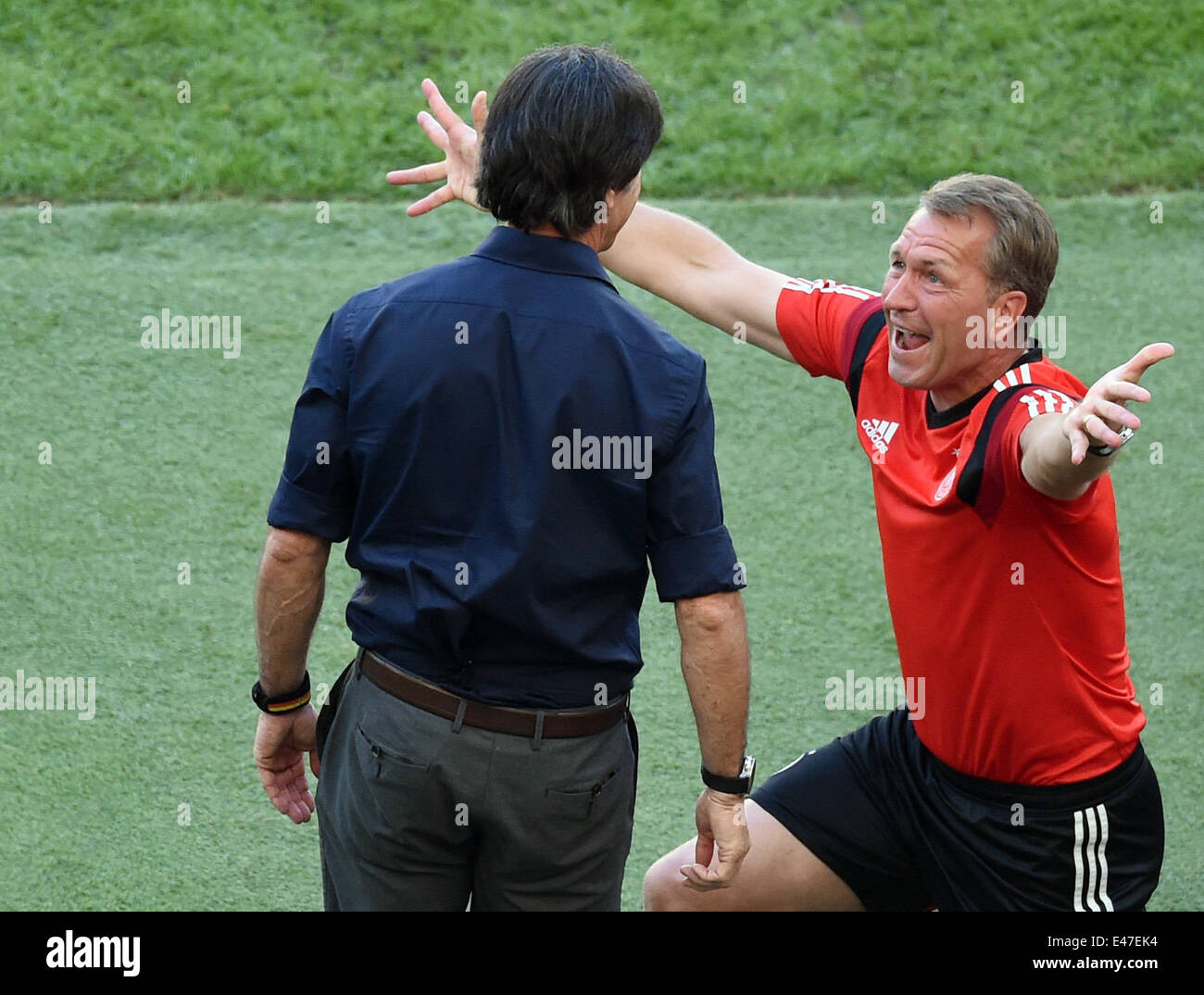 Rio de Janeiro, Brazil. 04th July, 2014. Head coach Joachim Loew (L) of Germany and goalkeeper coach Andreas Koepke celebrate during the FIFA World Cup 2014 quarter final soccer match between France and Germany at Estadio do Maracana in Rio de Janeiro, Brazil, 04 July 2014. Photo: Marcus Brandt/dpa/Alamy Live News Stock Photo