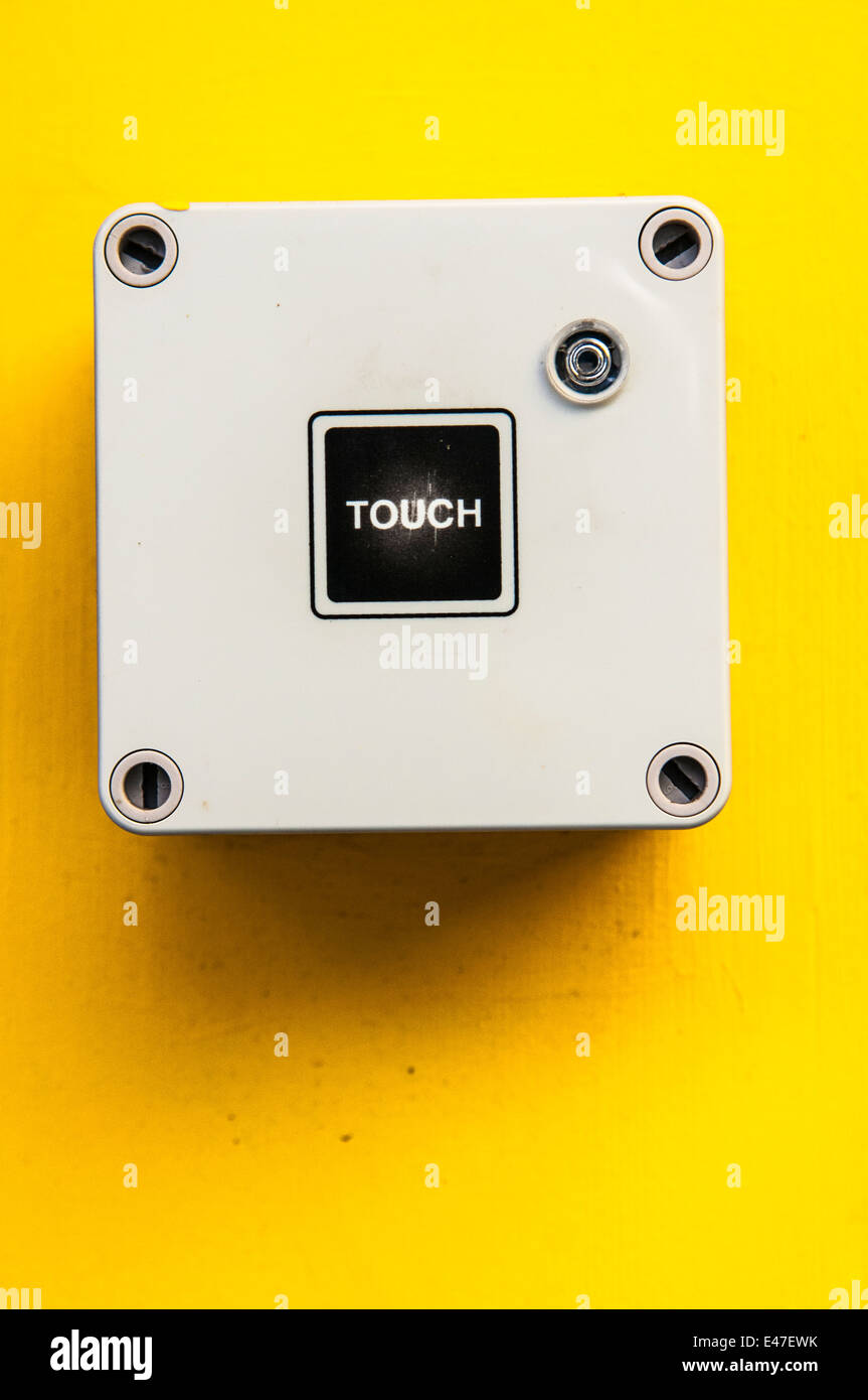 Electronic switch saying 'Touch' Stock Photo