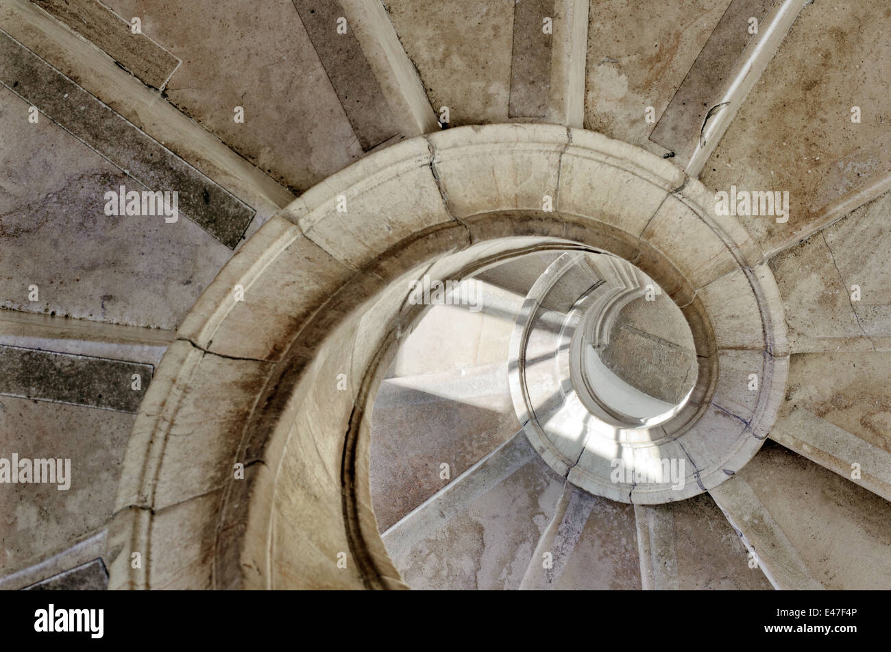 spiral stone stairway inside an old palace Stock Photo