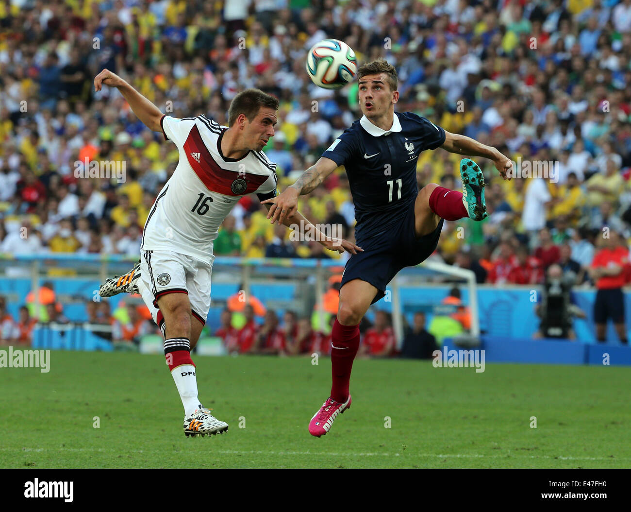 Rio De Janerio, Brazil. 04th July, 2014. FIFA World Cup 2014 quarter final soccer match between France and Germany at Estadio do Maracana in Rio de Janeiro, Brazil. Griezmann controls the ball pressed by Lahm Credit:  Action Plus Sports/Alamy Live News Stock Photo
