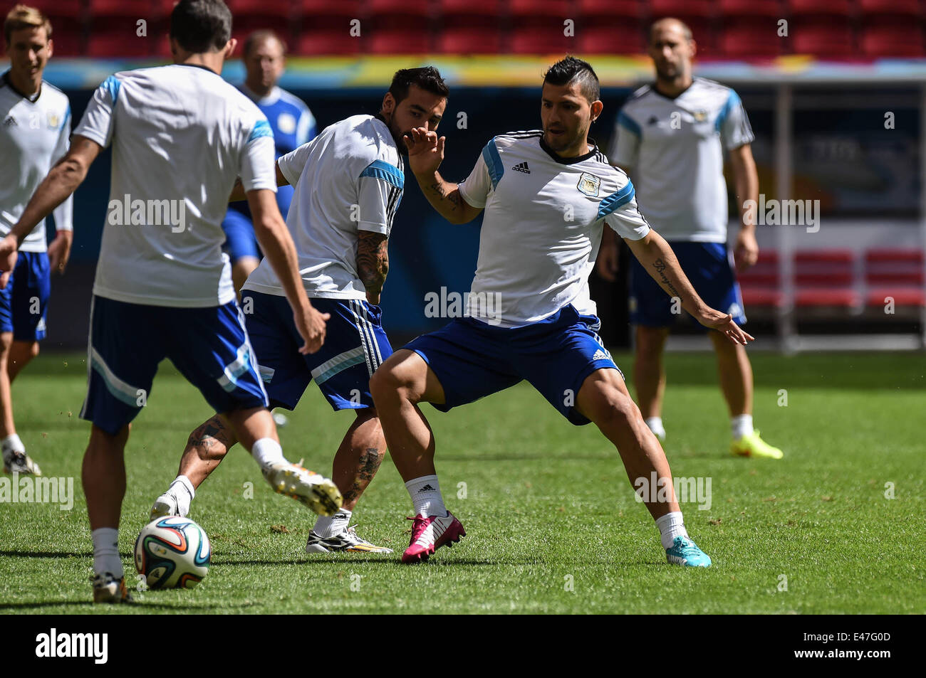 Brasilia. 4th July, 2014. Argentina's Sergio Aguero (2nd R) competes during a training session in Brasilia, Brazil, on July 4, 2014, ahead of a quarter-finals match between Argentina and Belgium of 2014 FIFA World Cup. Credit:  Liu Dawei/Xinhua/Alamy Live News Stock Photo