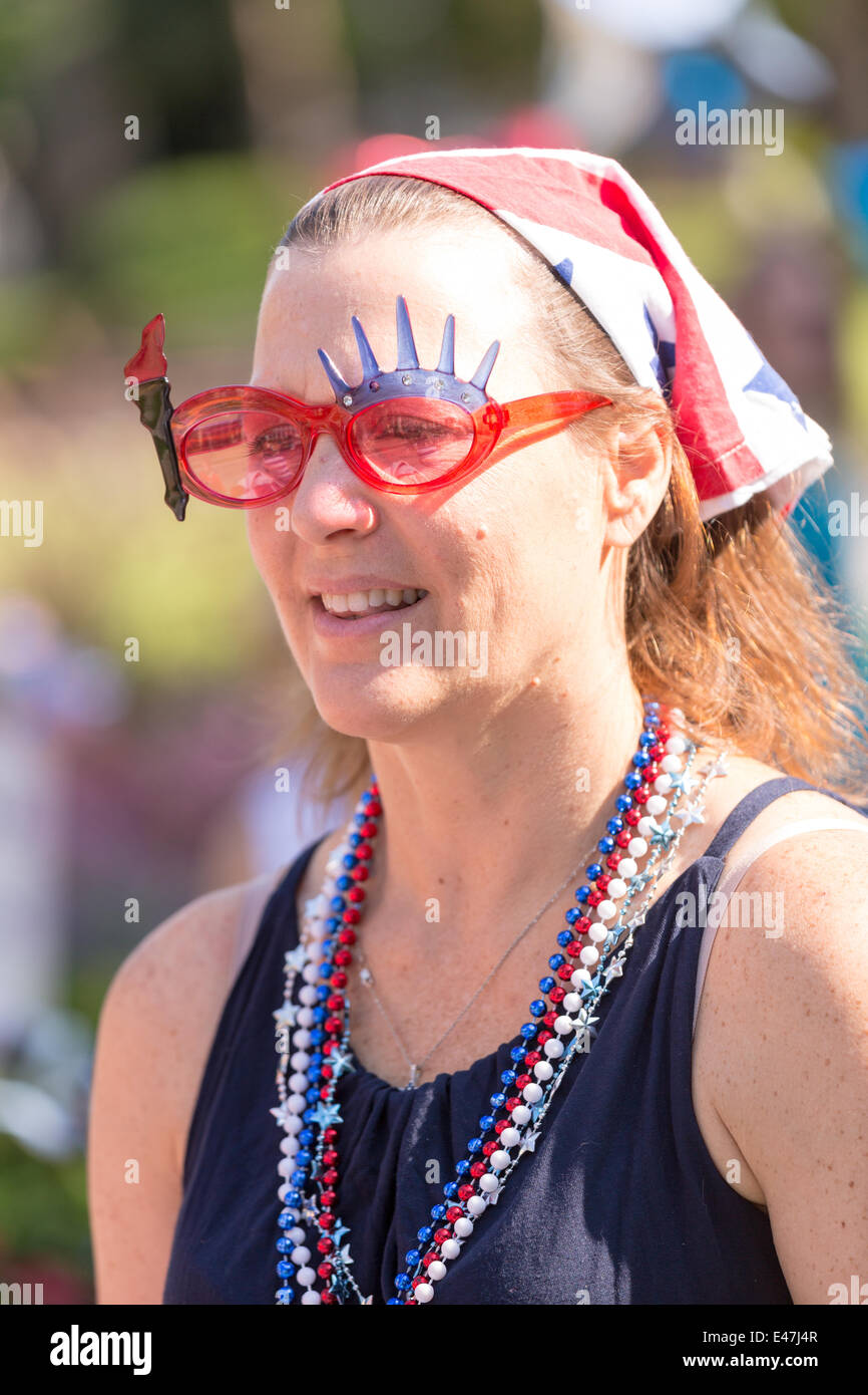 A woman wearing patriotic sunglasses and costume during the I'On