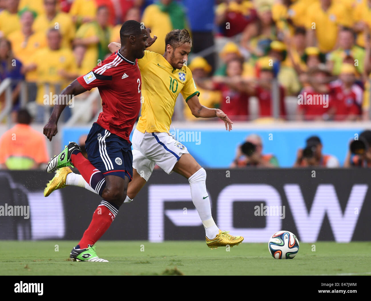 Fortaleza, Brazil. 04th July, 2014. Neymar (R) of Brazil and Cristian Zapata of Colombia vie for the ball during the FIFA World Cup 2014 quarter final match soccer between Brazil and Colombia at the Estadio Castelao in Fortaleza, Brazil, 04 July 2014. Photo: Marius Becker/dpa/Alamy Live News Stock Photo
