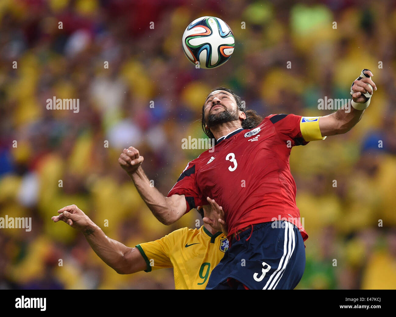 Fortaleza, Brazil. 04th July, 2014. Fred (L) of Brazil and Mario Yepes of Colombia vie for the ball during the FIFA World Cup 2014 quarter final match soccer between Brazil and Colombia at the Estadio Castelao in Fortaleza, Brazil, 04 July 2014. Photo: Marius Becker/dpa/Alamy Live News Stock Photo