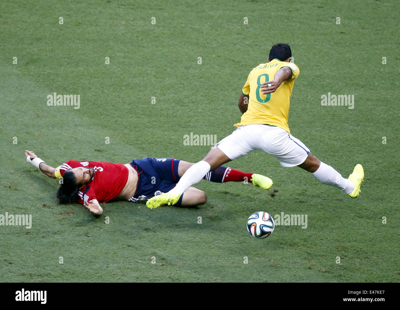 Fortaleza, Brazil. 4th July, 2014. Brazil's Paulinho (R) vies with Colombia's Mario Yepes during a quarter-finals match between Brazil and Colombia of 2014 FIFA World Cup at the Estadio Castelao Stadium in Fortaleza, Brazil, on July 4, 2014. Credit:  Liao Yujie/Xinhua/Alamy Live News Stock Photo