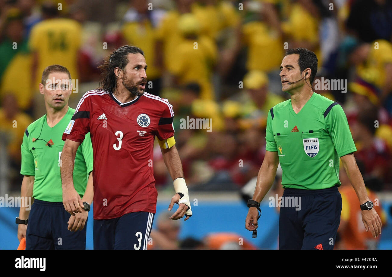 Fortaleza, Brazil. 04th July, 2014. Mario Yepes (C) of Colombia talks to referee Carlos Velasco Carballo (R) of Spain during the FIFA World Cup 2014 quarter final match soccer between Brazil and Colombia at the Estadio Castelao in Fortaleza, Brazil, 04 July 2014. Photo: Marius Becker/dpa/Alamy Live News Stock Photo