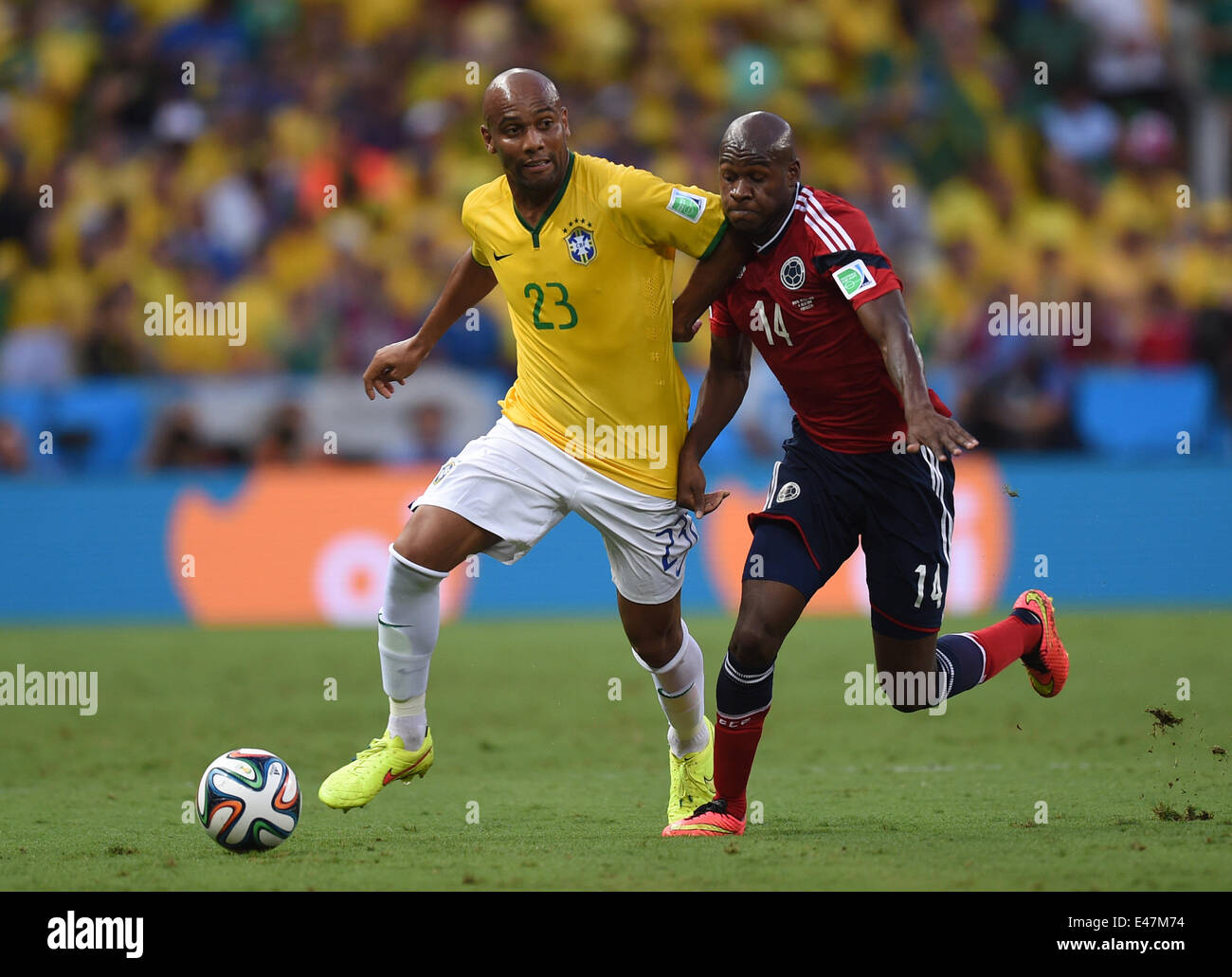 Fortaleza, Brazil. 04th July, 2014. Maicon (L) of Brazil and Victor Ibarbo of Colombia vie for the ball during the FIFA World Cup 2014 quarter final match soccer between Brazil and Colombia at the Estadio Castelao in Fortaleza, Brazil, 04 July 2014. Photo: Marius Becker/dpa/Alamy Live News Stock Photo