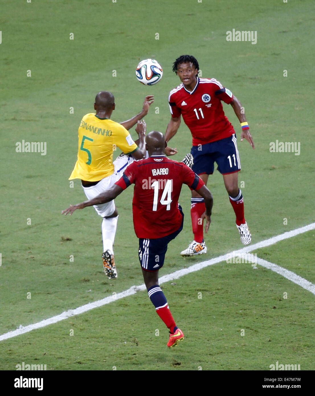 Fortaleza, Brazil. 4th July, 2014. Brazil's Fernandinho (L) competes with Colombia's Victor Ibarbo (C) and Juan Guillermo Cuadrado during a quarter-finals match between Brazil and Colombia of 2014 FIFA World Cup at the Estadio Castelao Stadium in Fortaleza, Brazil, on July 4, 2014. Credit:  Liao Yujie/Xinhua/Alamy Live News Stock Photo