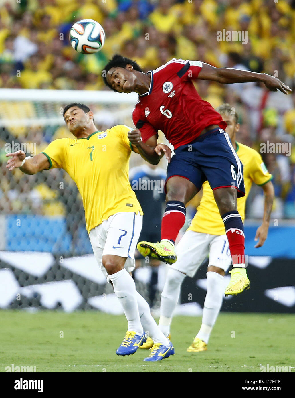 Fortaleza, Brazil. 4th July, 2014. Brazil's Hulk competes for a header with Colombia's Carlos Sanchez during a quarter-finals match between Brazil and Colombia of 2014 FIFA World Cup at the Estadio Castelao Stadium in Fortaleza, Brazil, on July 4, 2014. Credit:  Chen Jianli/Xinhua/Alamy Live News Stock Photo