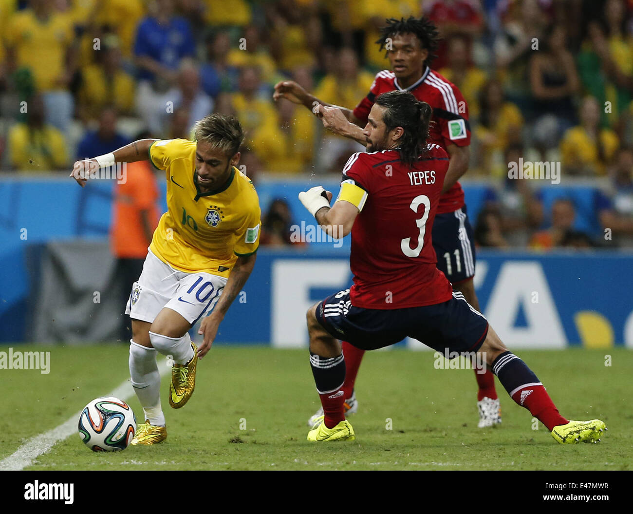 Fortaleza, Brazil. 4th July, 2014. Brazil's Neymar vies with Colombia's Mario Yepes during a quarter-finals match between Brazil and Colombia of 2014 FIFA World Cup at the Estadio Castelao Stadium in Fortaleza, Brazil, on July 4, 2014. Credit:  Zhou Lei/Xinhua/Alamy Live News Stock Photo