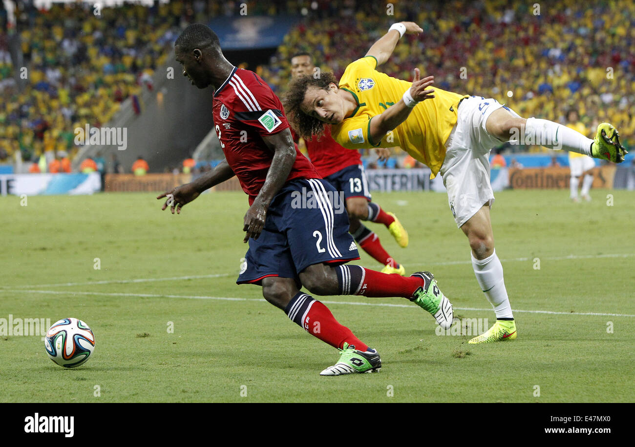 Fortaleza, Brazil. 4th July, 2014. Brazil's David Luiz vies with Colombia's Cristian Zapata during a quarter-finals match between Brazil and Colombia of 2014 FIFA World Cup at the Estadio Castelao Stadium in Fortaleza, Brazil, on July 4, 2014. Credit:  Zhou Lei/Xinhua/Alamy Live News Stock Photo