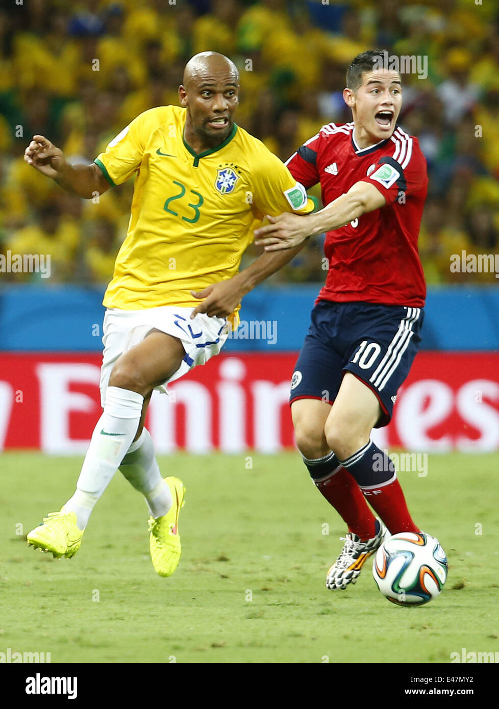Fortaleza, Brazil. 4th July, 2014. Brazil's Maicon vies with Colombia's James Rodriguez during a quarter-finals match between Brazil and Colombia of 2014 FIFA World Cup at the Estadio Castelao Stadium in Fortaleza, Brazil, on July 4, 2014. Credit:  Chen Jianli/Xinhua/Alamy Live News Stock Photo