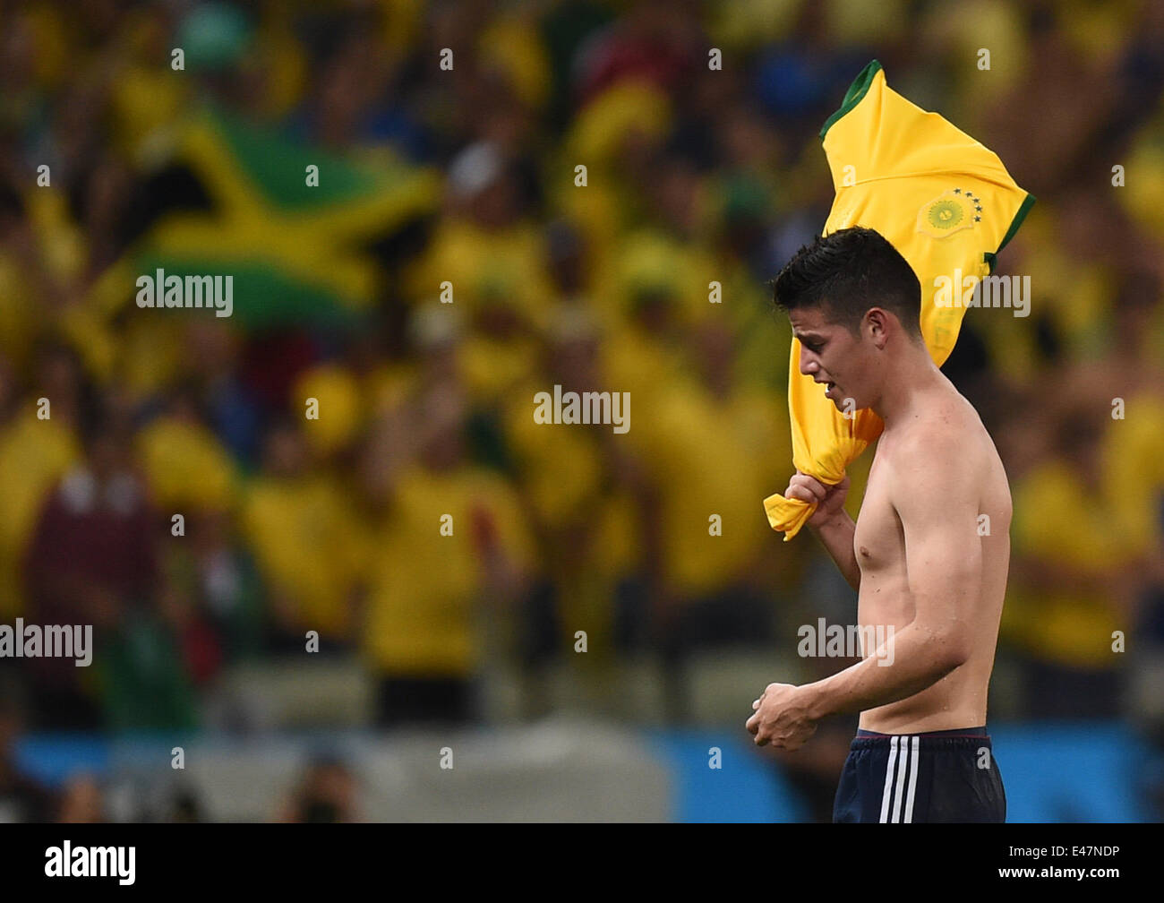 Fortaleza, Brazil. 04th July, 2014. James Rodriguez of Colombia leaves the pitch after the FIFA World Cup 2014 quarter final match soccer between Brazil and Colombia at the Estadio Castelao in Fortaleza, Brazil, 04 July 2014. Photo: Marius Becker/dpa/Alamy Live News Stock Photo