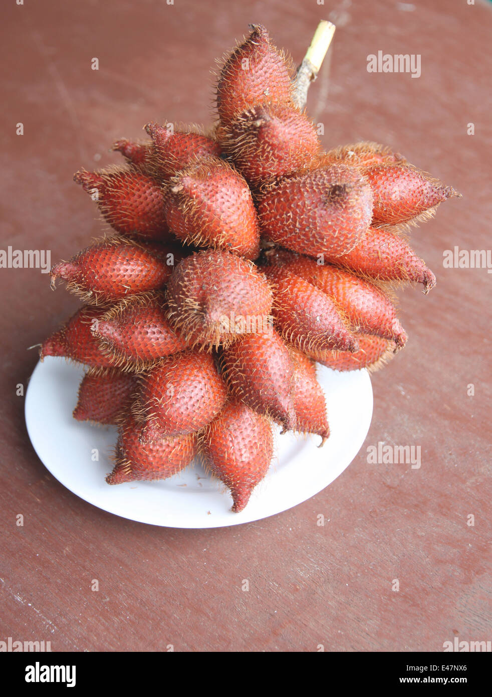 Fresh salacca edulis salak palm fruit in dish on the foods table. Stock Photo