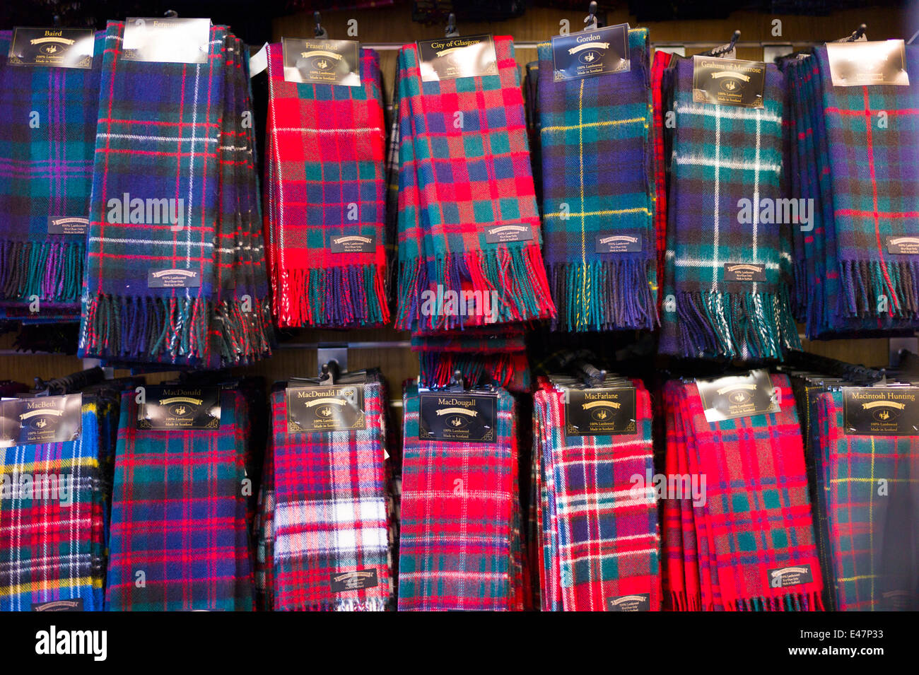 Traditional Scottish clan tartan scarves display for sale in James Pringle Weavers Shop in St Vincent Street in Glasgow SCOTLAND Stock Photo