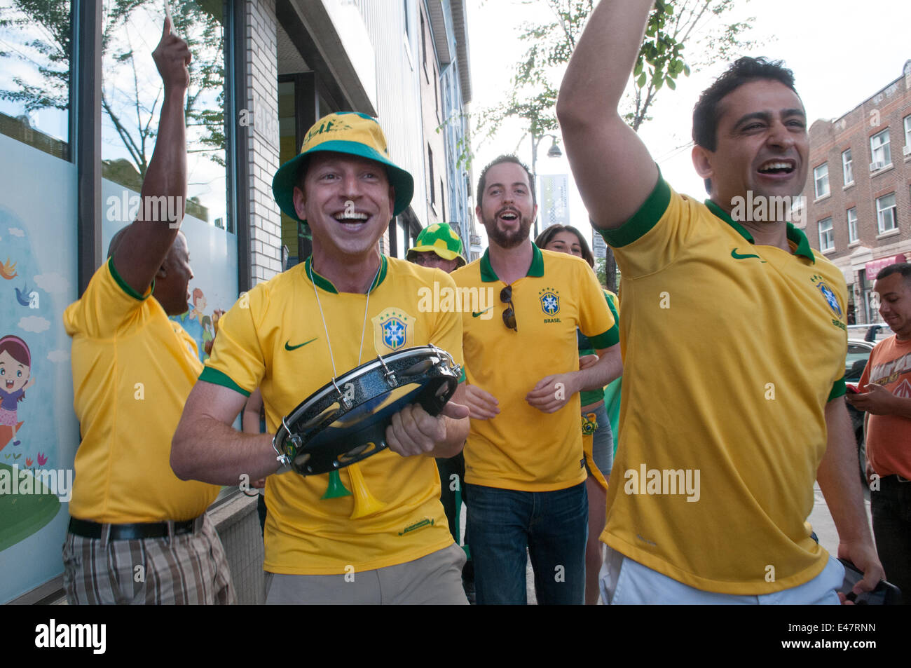 Montreal, Canada. 04th July, 2014. On Friday July 4th 2014, hundreds of soccer fans filled Montreal cafés and streets to watch the final quarter game between Colombia and Brazil. Upon Brazil's win citizens from Brazilian origin partied on the sidewalks. Credit:  Megapress/Alamy Live News Stock Photo