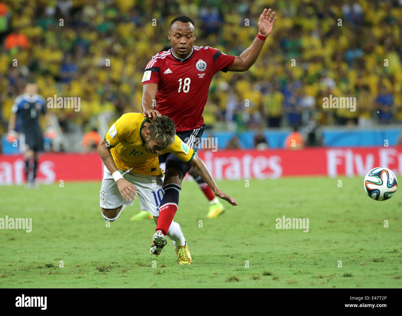 Fortaleza, Brazil. 4th July, 2014. Brazil's Neymar (L) is fouled by Juan Camilo Zuniga of Colombia during the quarterfinal match between Brazil and Colombia of 2014 Brazil FIFA World Cup at the Castelao Stadium, in Fortaleza, Brazil, on July 4, 2014. Credit:  AGENCIA ESTADO/Xinhua/Alamy Live News Stock Photo