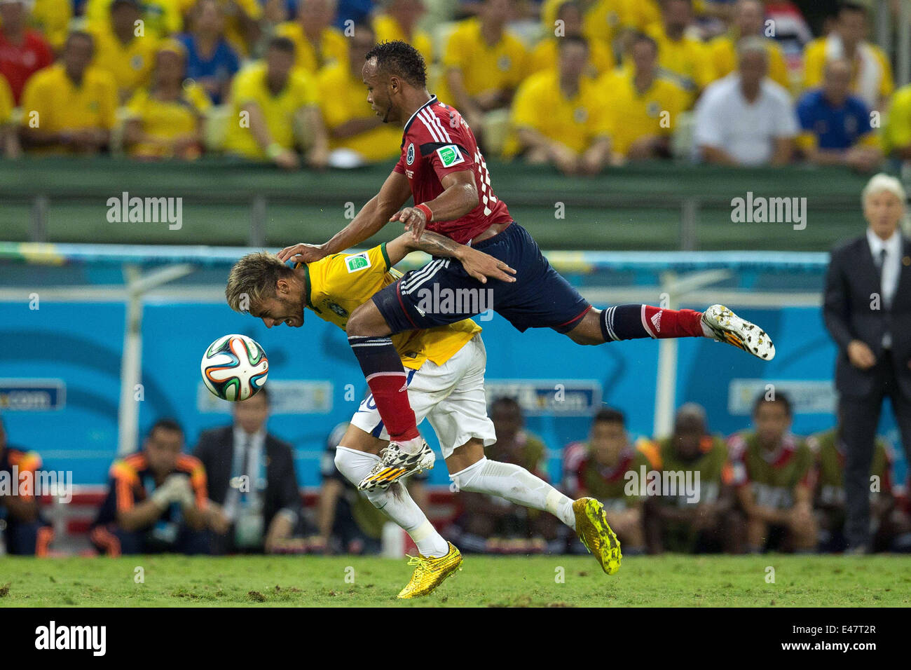 Fortaleza, Brazil. 4th July, 2014. Brazil's Neymar (L) is fouled by Juan Camilo Zuniga of Colombia during the quarterfinal match between Brazil and Colombia of 2014 Brazil FIFA World Cup at the Castelao Stadium, in Fortaleza, Brazil, on July 4, 2014. Credit:  AGENCIA ESTADO/Xinhua/Alamy Live News Stock Photo
