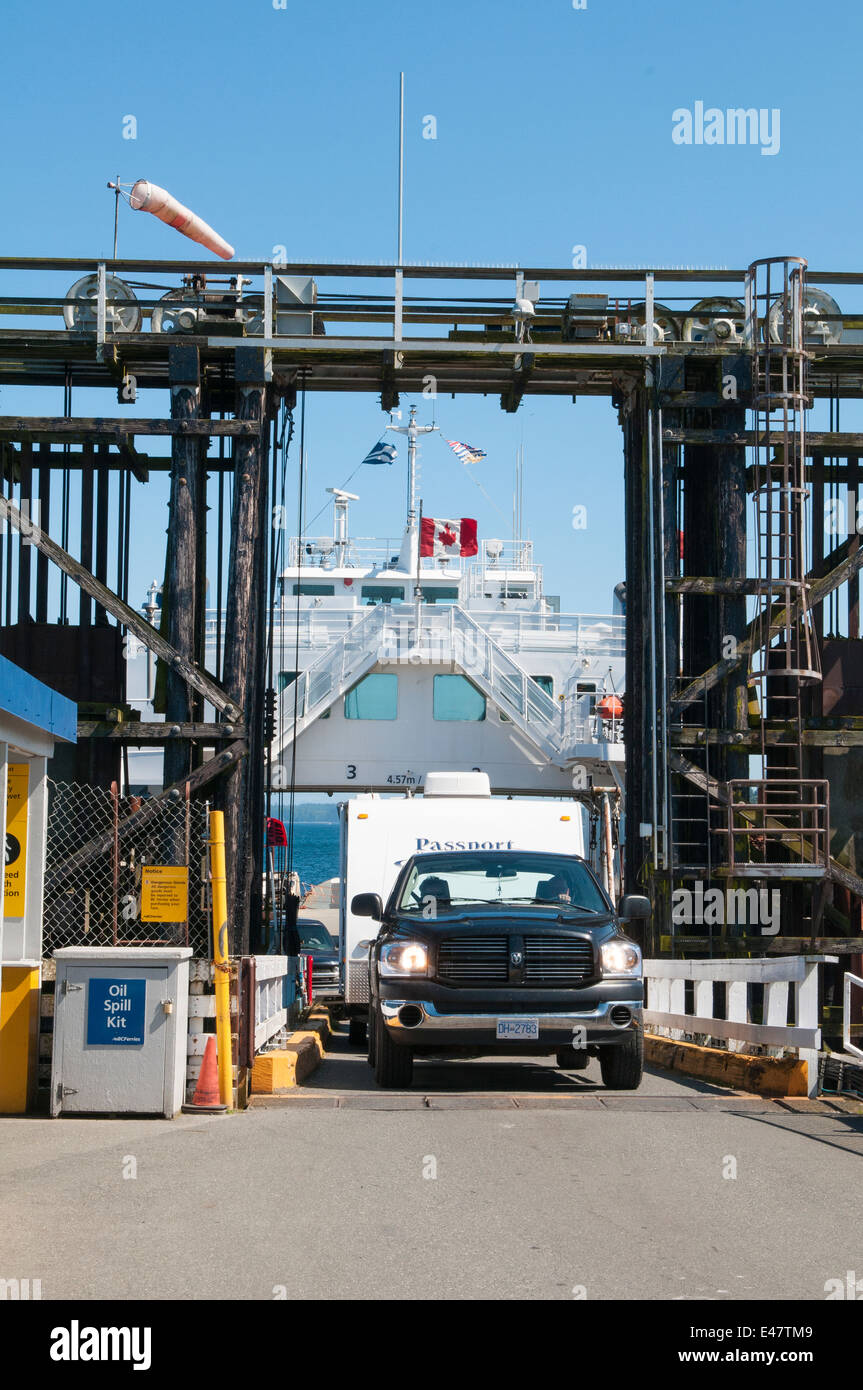 Truck trailer rv disembarking from BC Ferry terminal dock pier Port