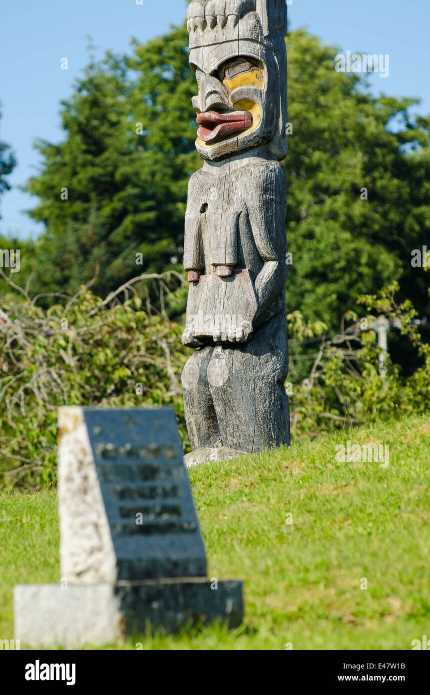 First Nation native totem story monument pole in cemetery in Alert Bay ...