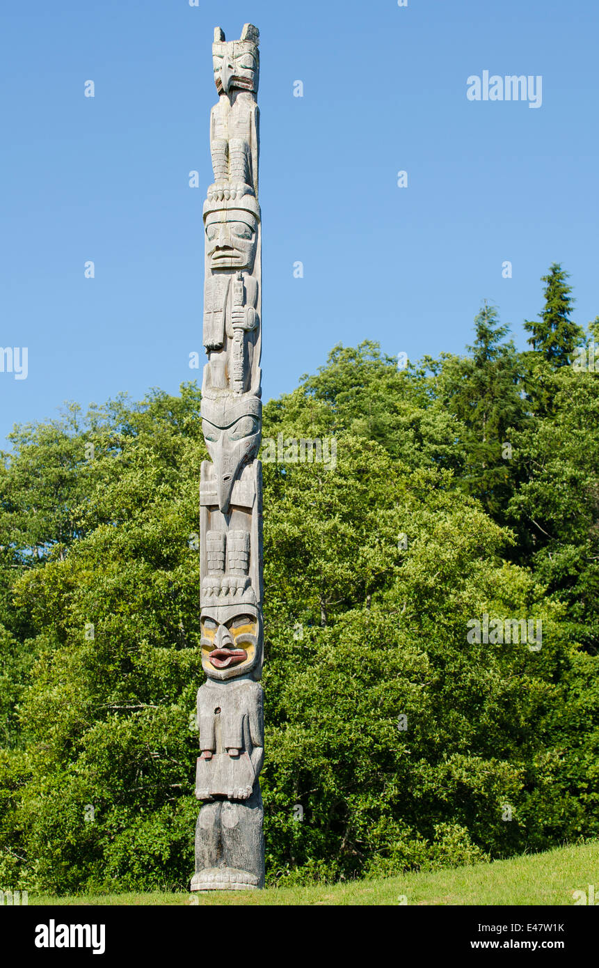 First Nation native totem story monument pole in cemetery in Alert Bay